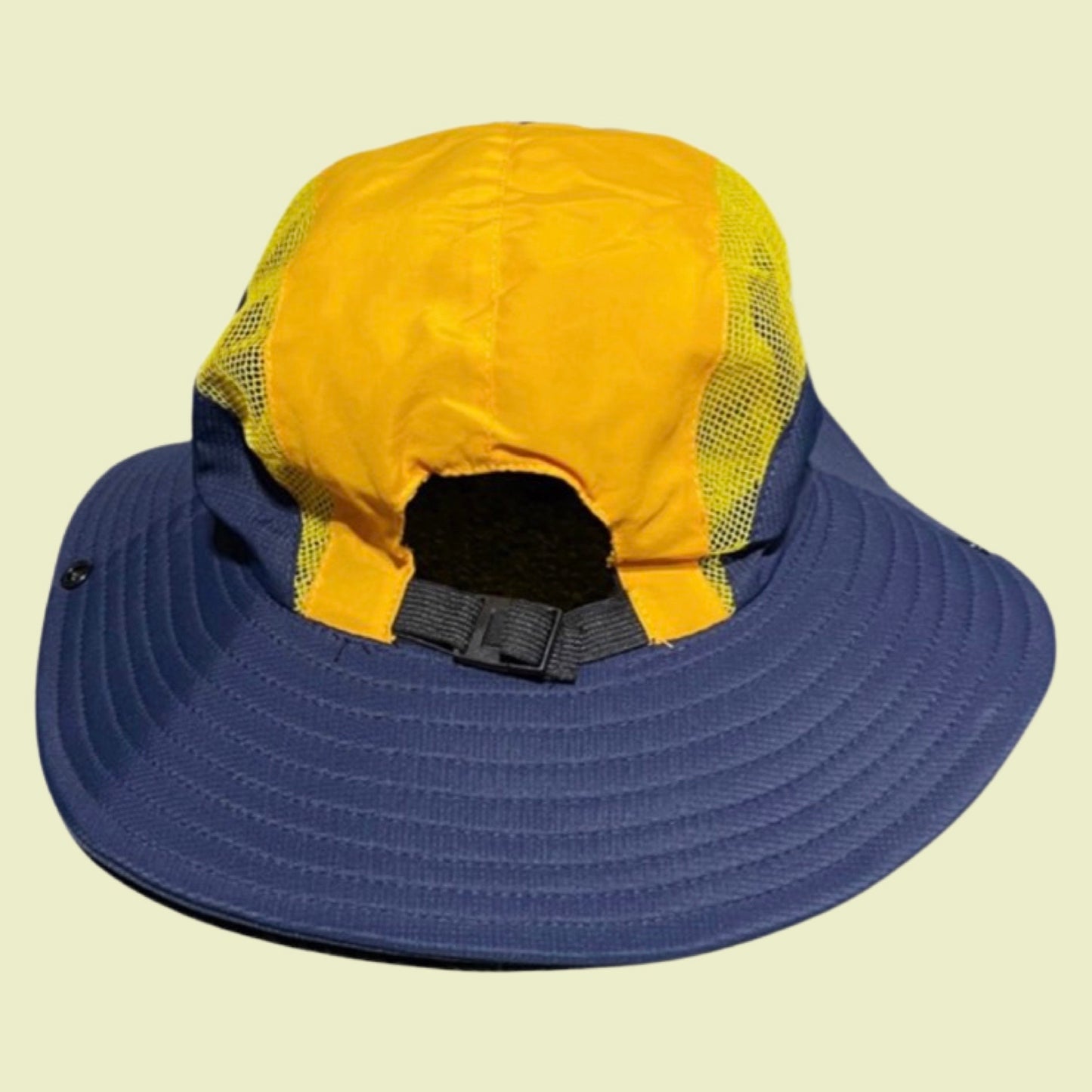 Back of the Cloud logo bucket hat with side air vents and adjustable nylon strap. 