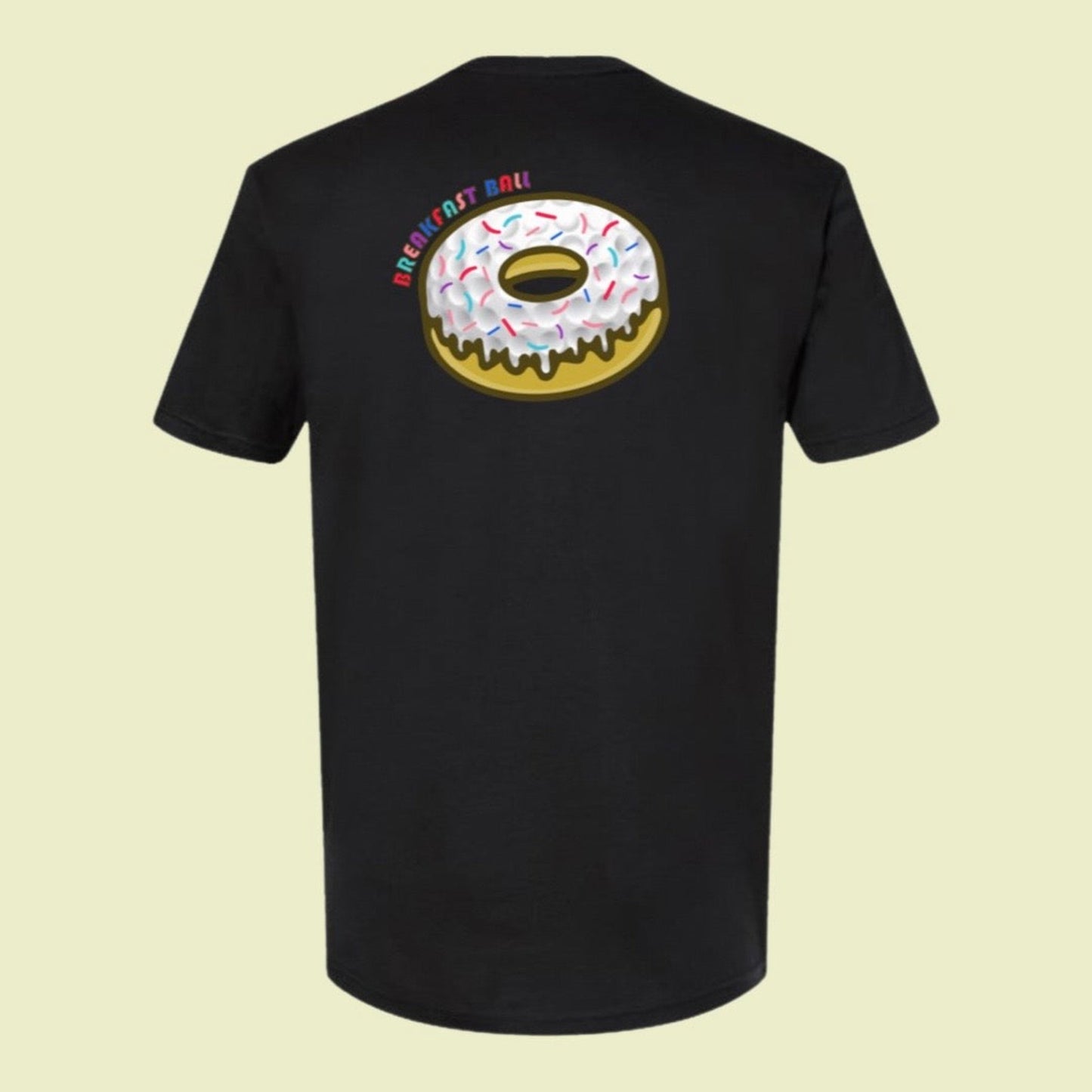 back of breakfast ball golf shirt in black with donut golf ball graphic in multiple colors