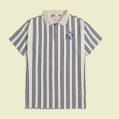 Front of the OG polo classic stripped golf polo with cream and navy stripes.  Cloud logo on front left chest.   