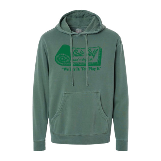 front of the sod and turf pigment dyed green golf hoodie