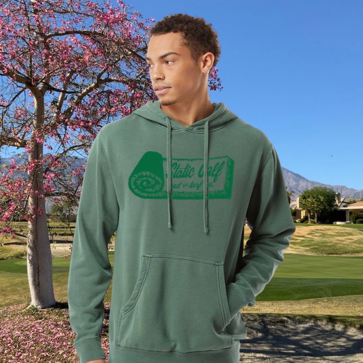 man wearing the sod and turf golf hoodie